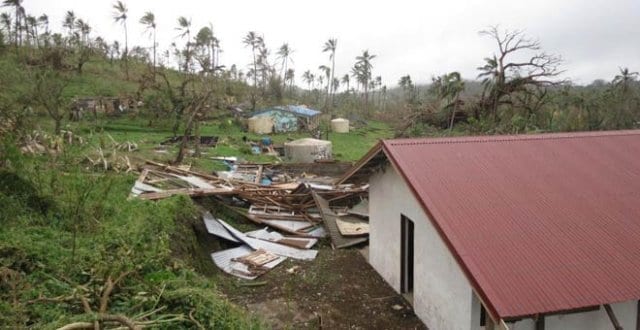 The blue-green building in the distance is the RTC built by Oxfam, this was the main building that was used as a shelter from the storm. 