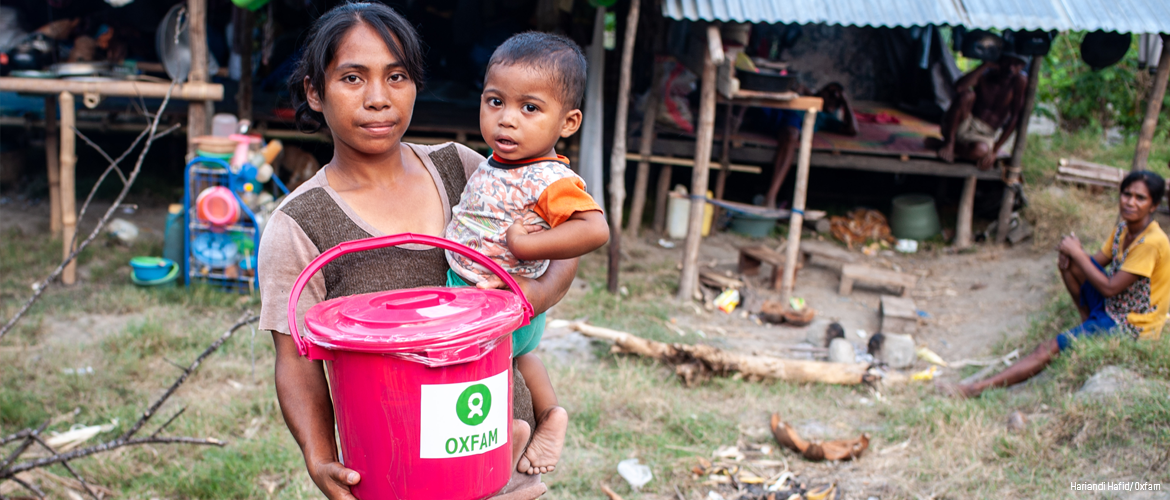 Woman and child with Oxfam hygiene and water aid