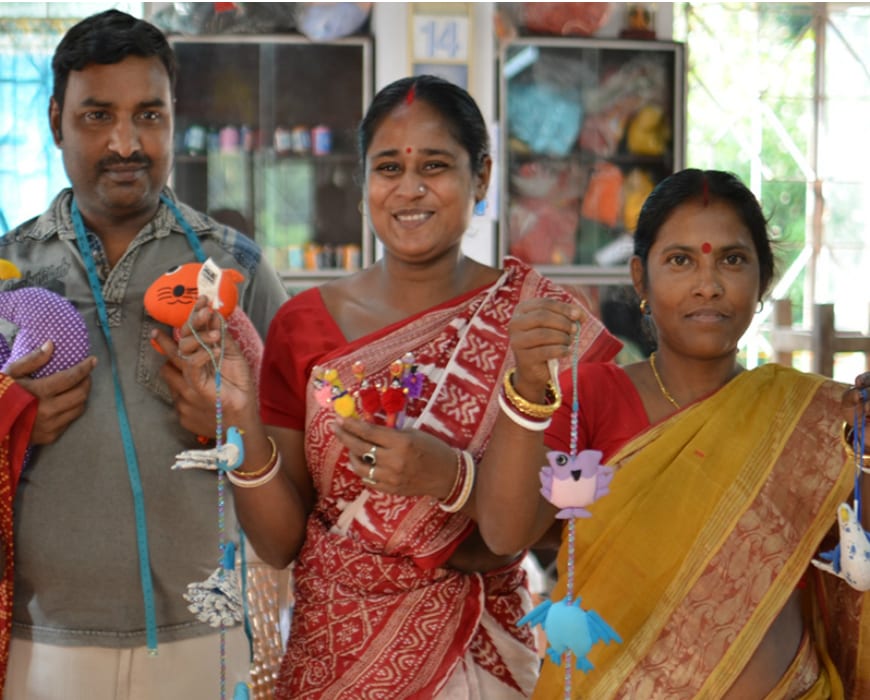 Sasha artisans with their products.