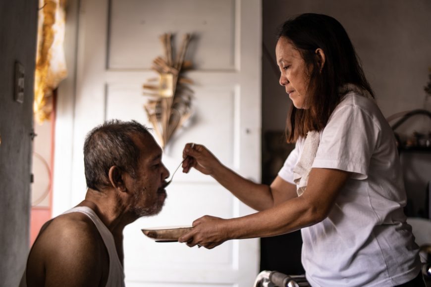 Care worker tending to her husband