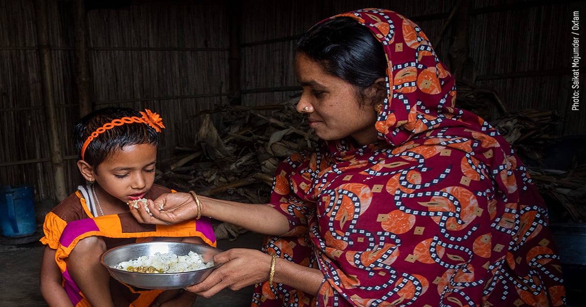 woman feeding her child