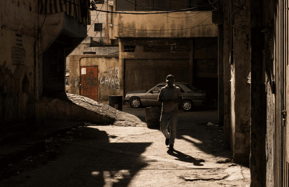 Image of a person in a dark alley