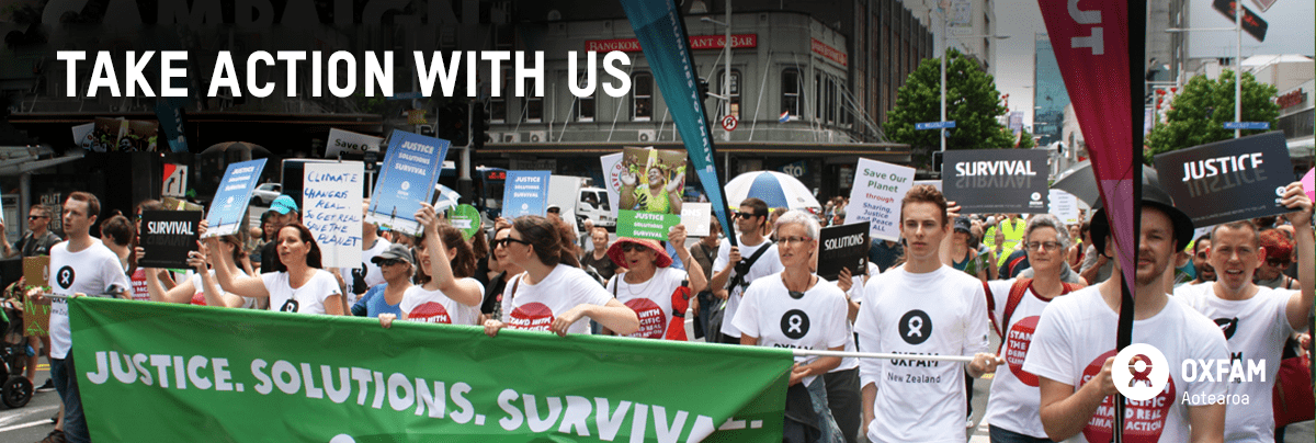 Image of people at a climate protest with text 'Take action with us'