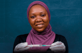 Woman holding a vaccine