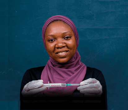 Woman holding a vaccine