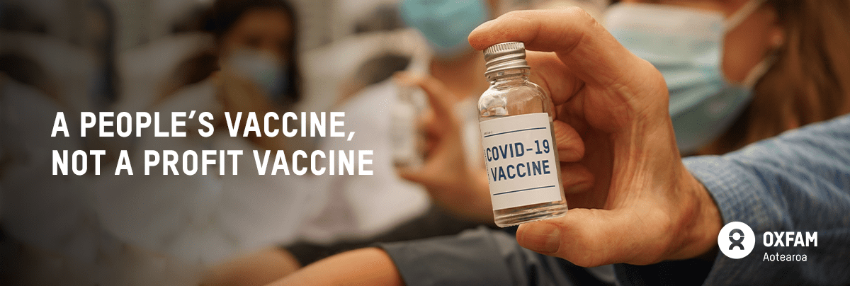 Hand holding a vial with text A people's vaccine, not a profit vaccine