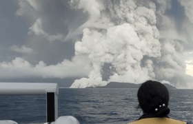Image of a large volcanic eruption at sea