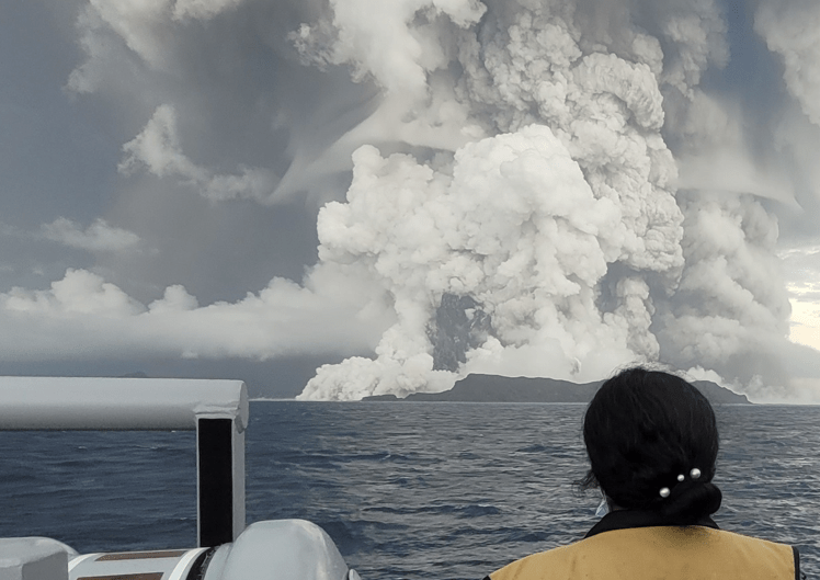 Image of a large volcanic eruption at sea