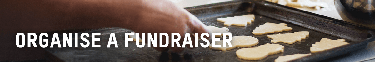 Organise a fundraiser banner with tray of cookies