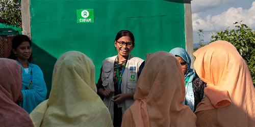 Iffat speaks to a group of women