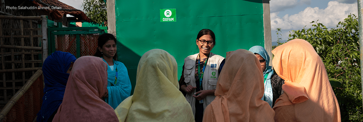 Iffat speaks to a group of women