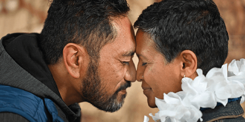 Our Commitment to Te Tiriti o Waitangi with two people doing a hongi