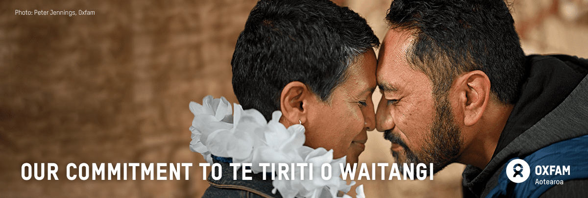 Our Commitment to Te Tiriti o Waitangi with two people doing a hongi