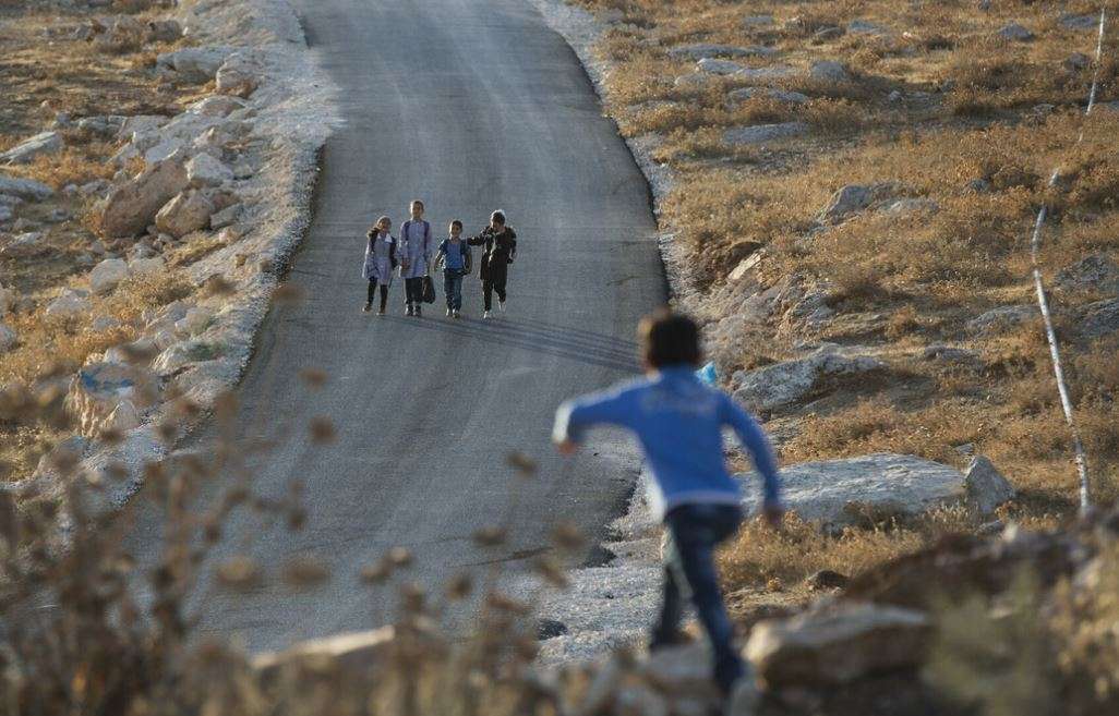 Palestinian school children in the early morning