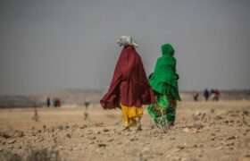 Two women walk together