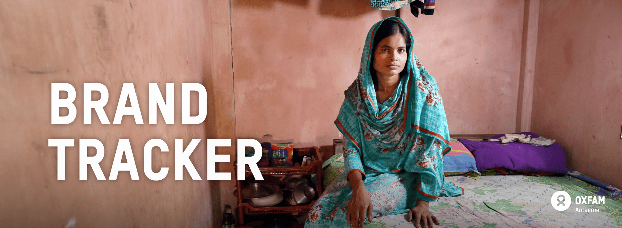 Woman sitting on bed with 'brand tracker' text