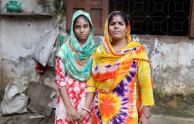Two women stand together
