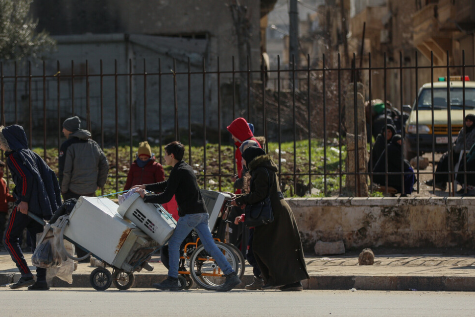 A family walks together following the earthquake