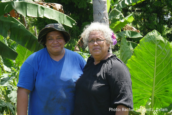 Two women standing in farm
