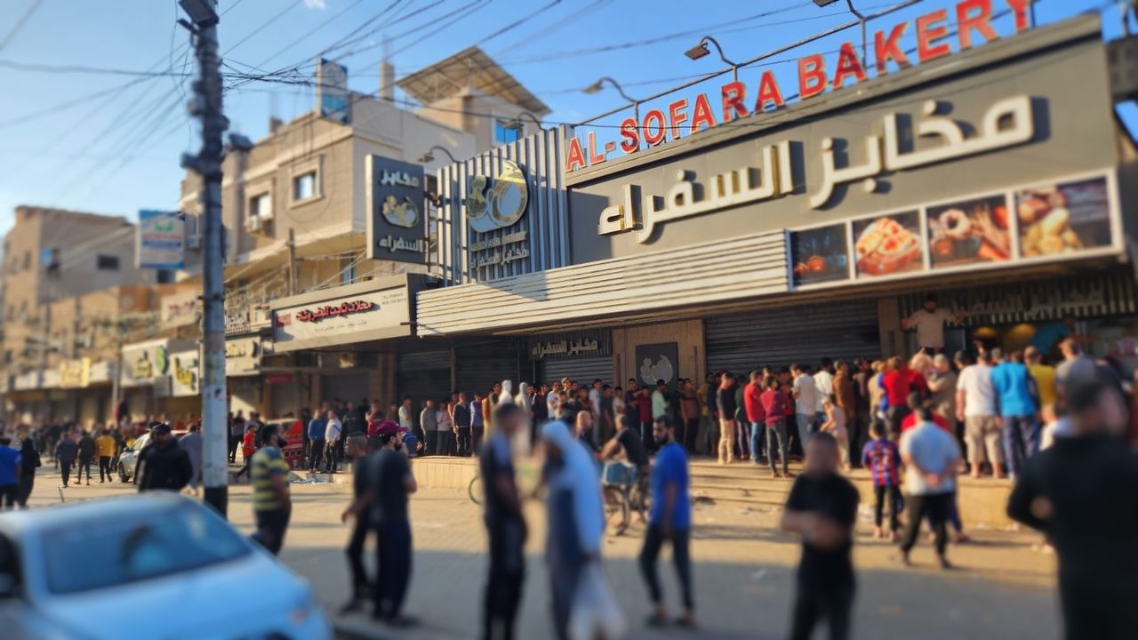 people in line at a bakery in Gaza