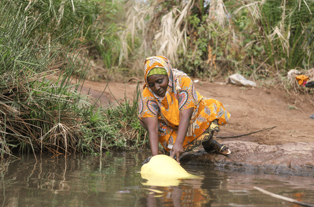 Woman collecting water