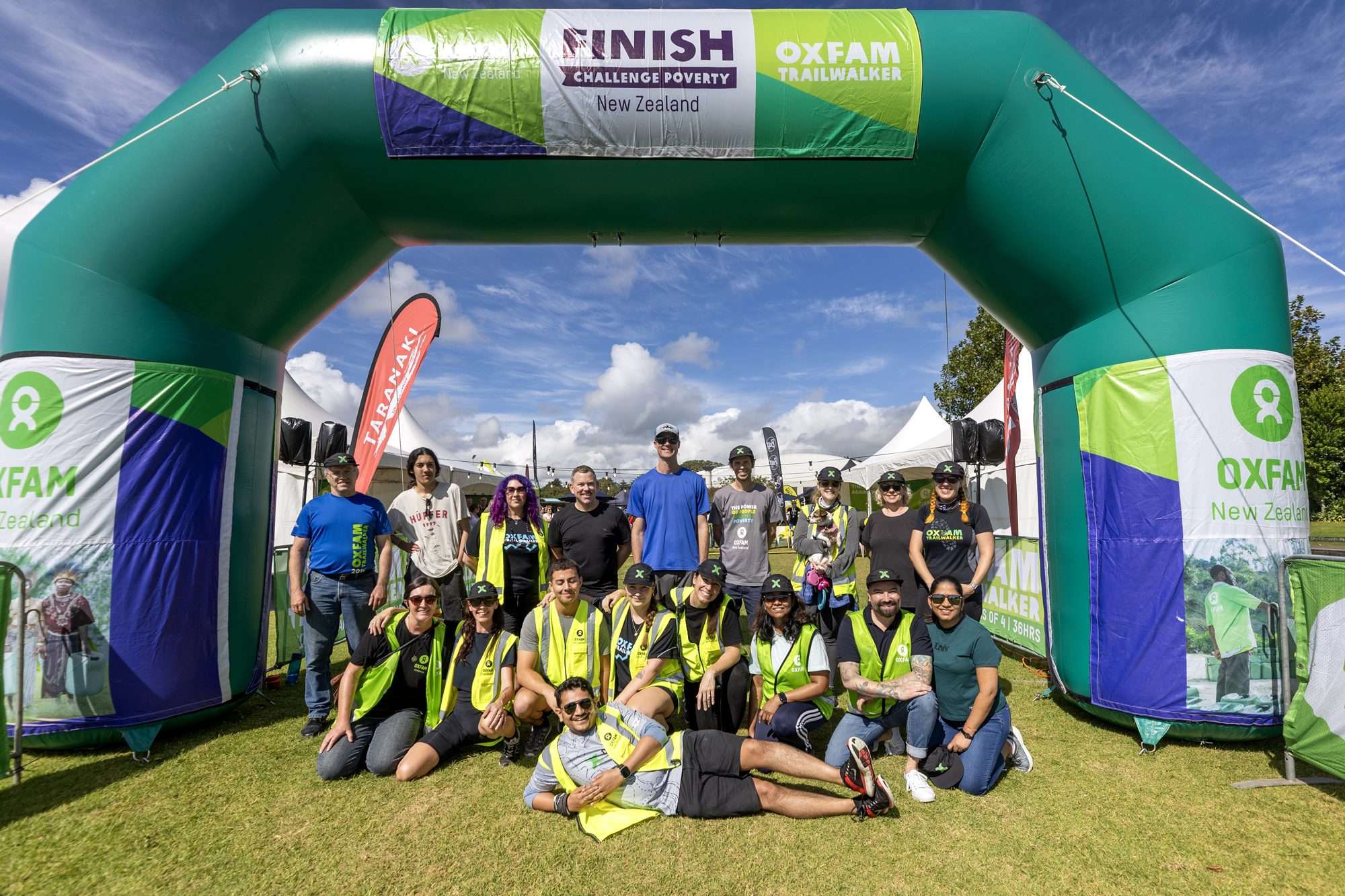 staff members celebrate at the finish line