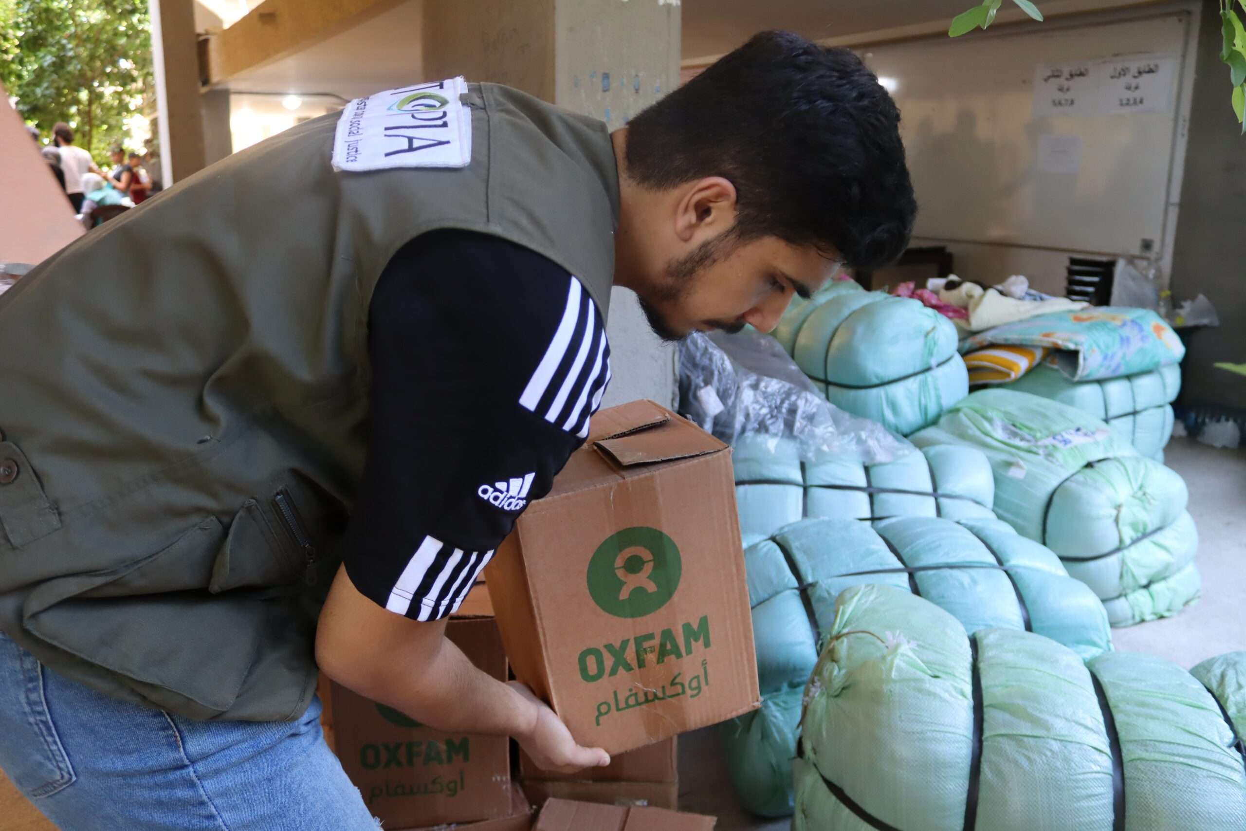 Mohammad giving hygiene kits to displaced people in Gaza