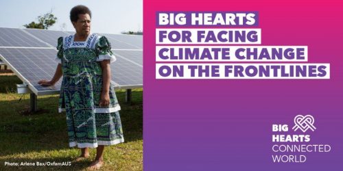 Image of a woman standing in front of solar panels with text Big Hearts for facing climate change on the front lines
