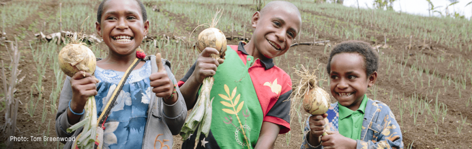 PNG Website header page Three children smiling and holding onions